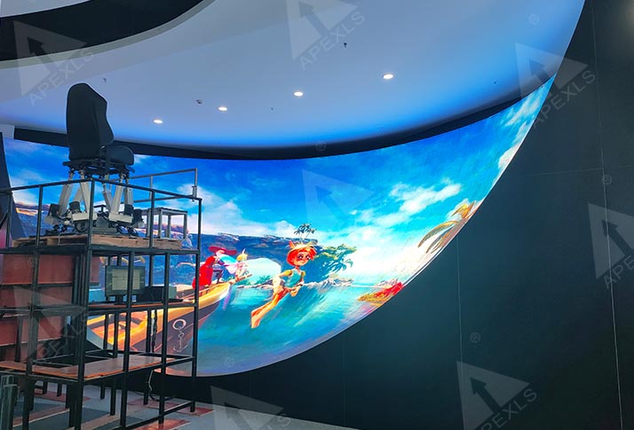 Indoor immersive LED dome display and interactive seating in the foreground