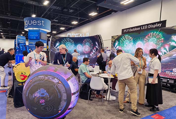 Visitors stopping by the Apexls booth